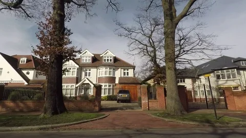 Right Side View Of A Car Drives By Rich Area Big Luxury Homes in the UK Stock Footage 73318544