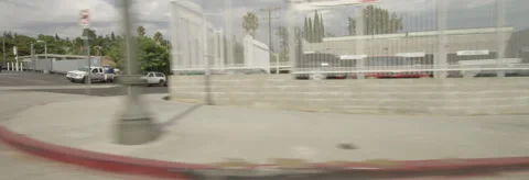 Right Side view of a Driving Plate: Car travels on Cahuenga Boulevard in Los Stock Footage 59411170