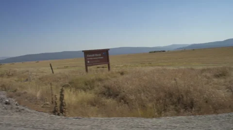 Right Side view of a Driving Plate: Car turns left onto Silver Lake Road (County Stock Footage 59511707