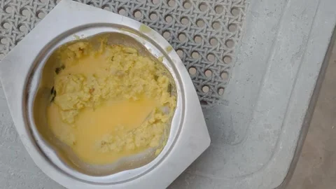 Right side view of yellow lentils in deep metal vessel Видео 347991098
