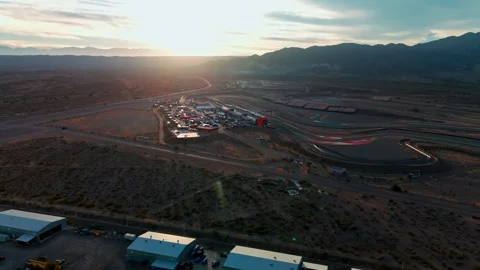 Right side wide drone shot over service park parc ferme Circuito San Juan 動画素材 343411336