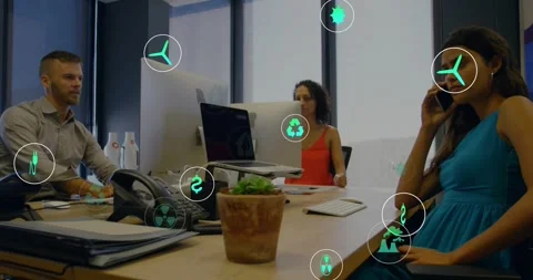 Right-side woman on phone while team watching monitor, green icons appearing, Stock Footage 331571015