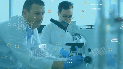 Right tech placing slide, causing data overlays, left tech viewing microscope, Stock Footage 321161268