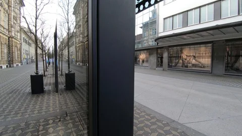 Right truck, parallel moving empty Ljubljana city street and bus station Stock Footage 127832638
