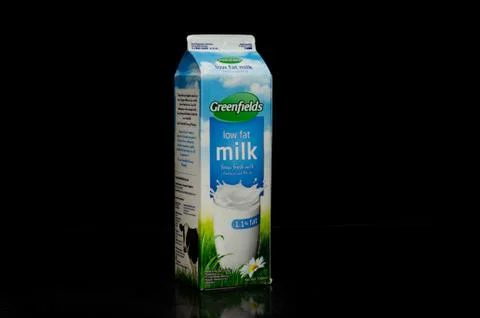Right view of one liter of a low fat milk box from the Greenfields trademark  Stock Photos