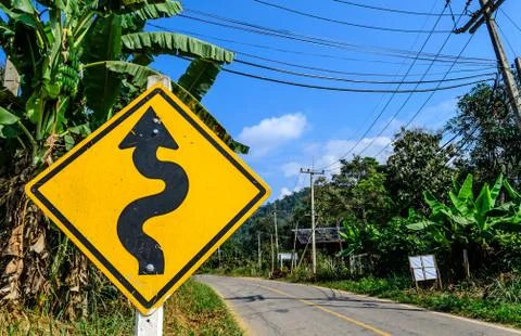 Right winding road traffic sign Stock Photos