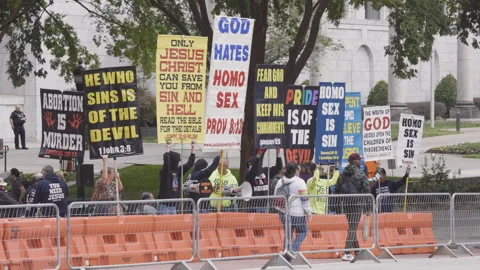 Right wing extremists display homophobic signs at Atlanta pride parade Stock Footage 274367767