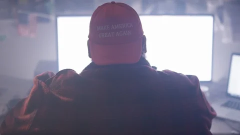 Right wing troll on his computer 4chan posting memes Stock Footage 116676272