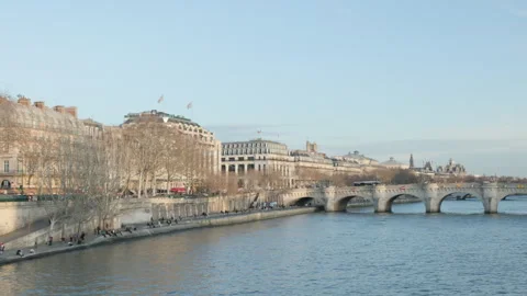 Rightward camera pan along the Seine River from Pont des Arts Stock Footage 323912283