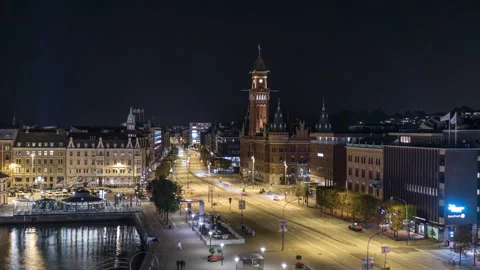 Rightward Pan Past Helsingborg Town Hall and Night Traffic Stock Footage 343803549