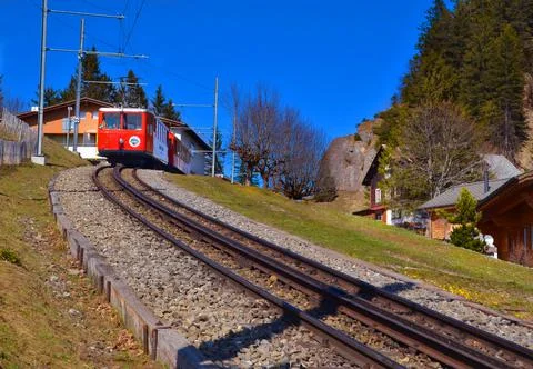 RIGI TRAIN FRONT ENGINE VIEW SET AT THE BACKDROP OF PICTURESQUE SWISS ALPS Stock Photos