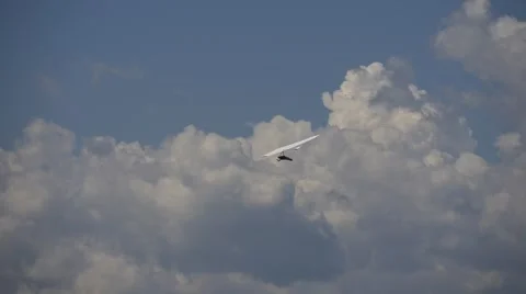 Rigid wing hang glider flying among the clouds Stock Footage 67573469