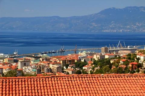 Rijeka downtown sunlit red roofs with blue Adriatic Sea Croatia Stock Photos