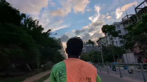A rikshaw puller pulling the rikshaw in an evening Stock Footage 203927828