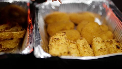 Rilled wings in the foreground. Selective focus on delicious chicken meat baked  Video stock 127541880
