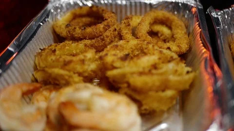 Rilled wings in the foreground. Selective focus on delicious chicken meat baked  Stock Footage 127541895