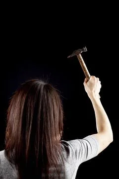 A rim light dark background image of a young caucasian woman with long brown  Stock Photos