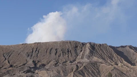 Rim of smoking volcano in Bromo Java Indonesia Stock Footage 81943308