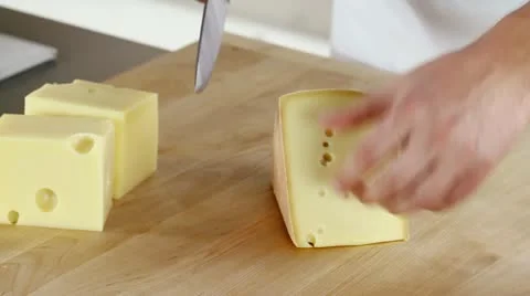 Rind being cut off a piece of cheese being Video stock 24670461