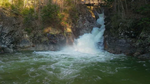Rindbach Waterfall cascade flowing into clear mountain river basin in Ebensee Stockbeeldmateriaal 345683534