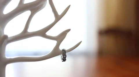 Ring on beautiful angel on the background of bride bouquet Stock Footage 63609150