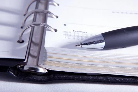 Ring Binder Notebook with Pen Close Up on White Background Stock Photos