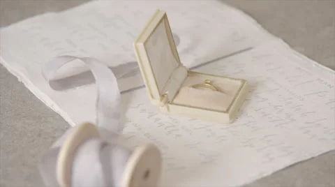 Ring Box and Spool of Ribbon Stock Footage 55375179