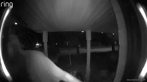 Ring Camera Captures Man Falling Into Home, Granite City, Illinois, USA - 22 Aug Stock Footage 323143406