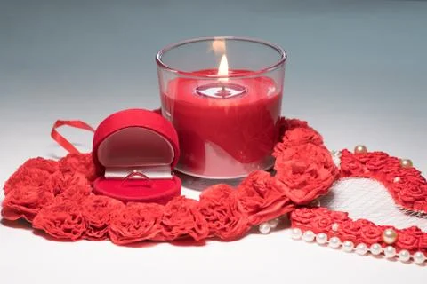 The ring in a case in the form of a heart stands on a white table. Composition Foto stock