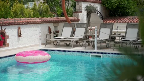 Ring floating in a refreshing blue swimming pool 스톡 동영상 133561837