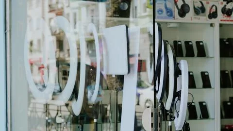Ring lights displayed in an electronics store window for photography and cont Stock Photos