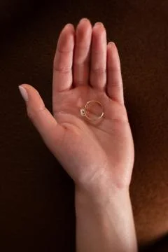 Ring in the palm of hand. Stock Photos
