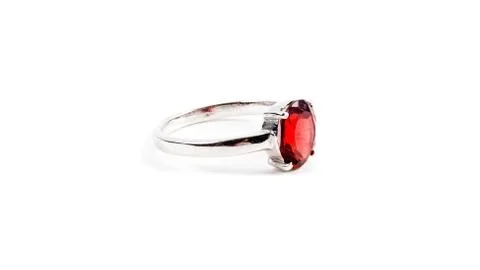 Ring with the red ruby stone isolated on white 库存照片