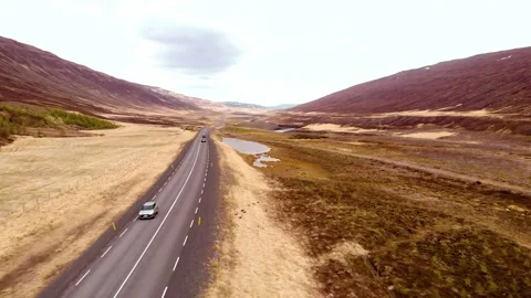 Ring Road (Route 1) in typical Iceland landscape with cars passing by Stock Footage 130853478