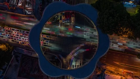 Ring shaped footbridge above night traffic - Shenzhen Vídeos de archivo 346612673