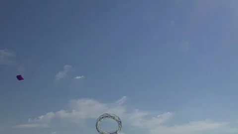 Ring-shaped kites flying in the sky Stock Footage 76142551