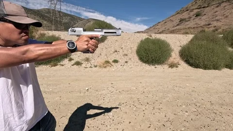 Ring shaped muzzle flash from Desert Eagle Stock Footage 252626616