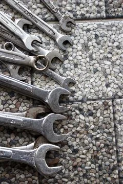 Ring wrenches of various sizes scattered on the floor Photos