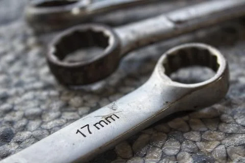 Ring wrenches of various sizes scattered on the floor Photos