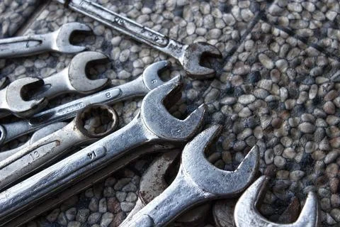 Ring wrenches of various sizes scattered on the floor Photos
