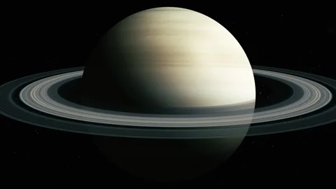 Ringed planet floating in dark space with a bright pale surface and wide ri.. Stock Footage 340382861