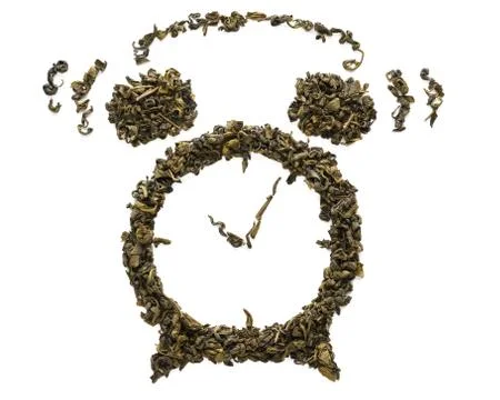 Ringing alarm clock shape made of dry Oolong tea leaves. Stock Photos