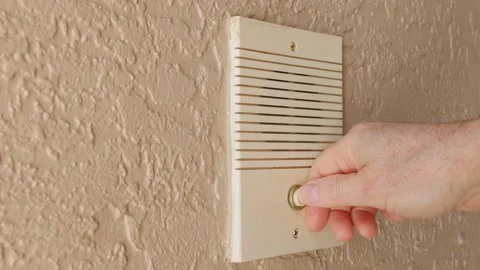 Ringing doorbell by pushing home intercom door bell button. Stock Footage 151027291