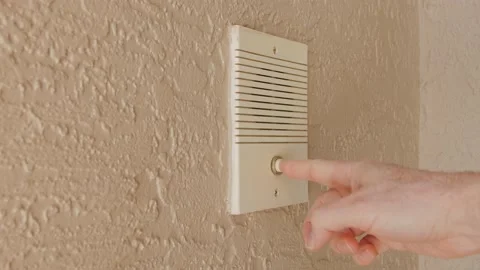 Ringing doorbell by pushing home intercom door bell button. Stock Footage 151027317