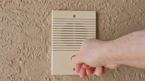 Ringing doorbell by pushing home intercom door bell button. Stock Footage 151027318
