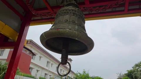 Ringing Peace: A Close-Up View of a Temple Bell in India Stock Footage 317070367