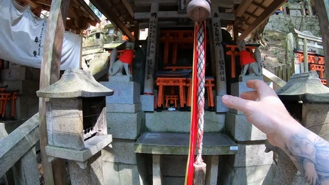 Ringing a shrine bell. Stock Footage 128706228