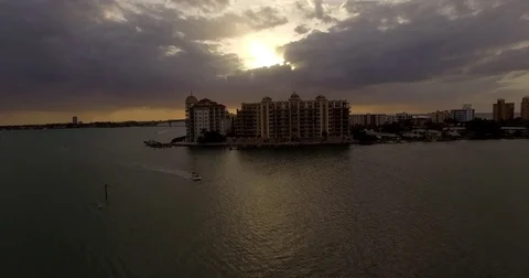 Ringling Bridge up and over Boat and Million Dollar Condo at Sunset in Sarasota Vídeos de archivo 74736711