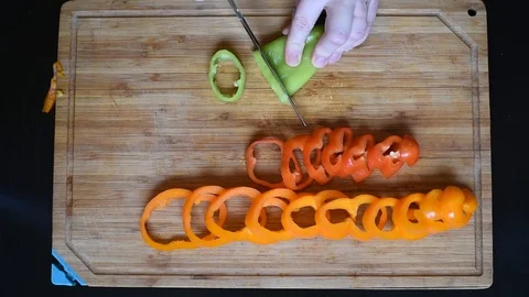 Rings of bell pepper of different colors on a wooden Board background Stock-Footage 96058249