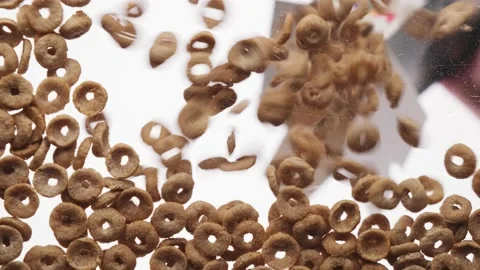 Rings cereal falling on a transparent background, bottom view. Morning breakfast Video stock 156475932